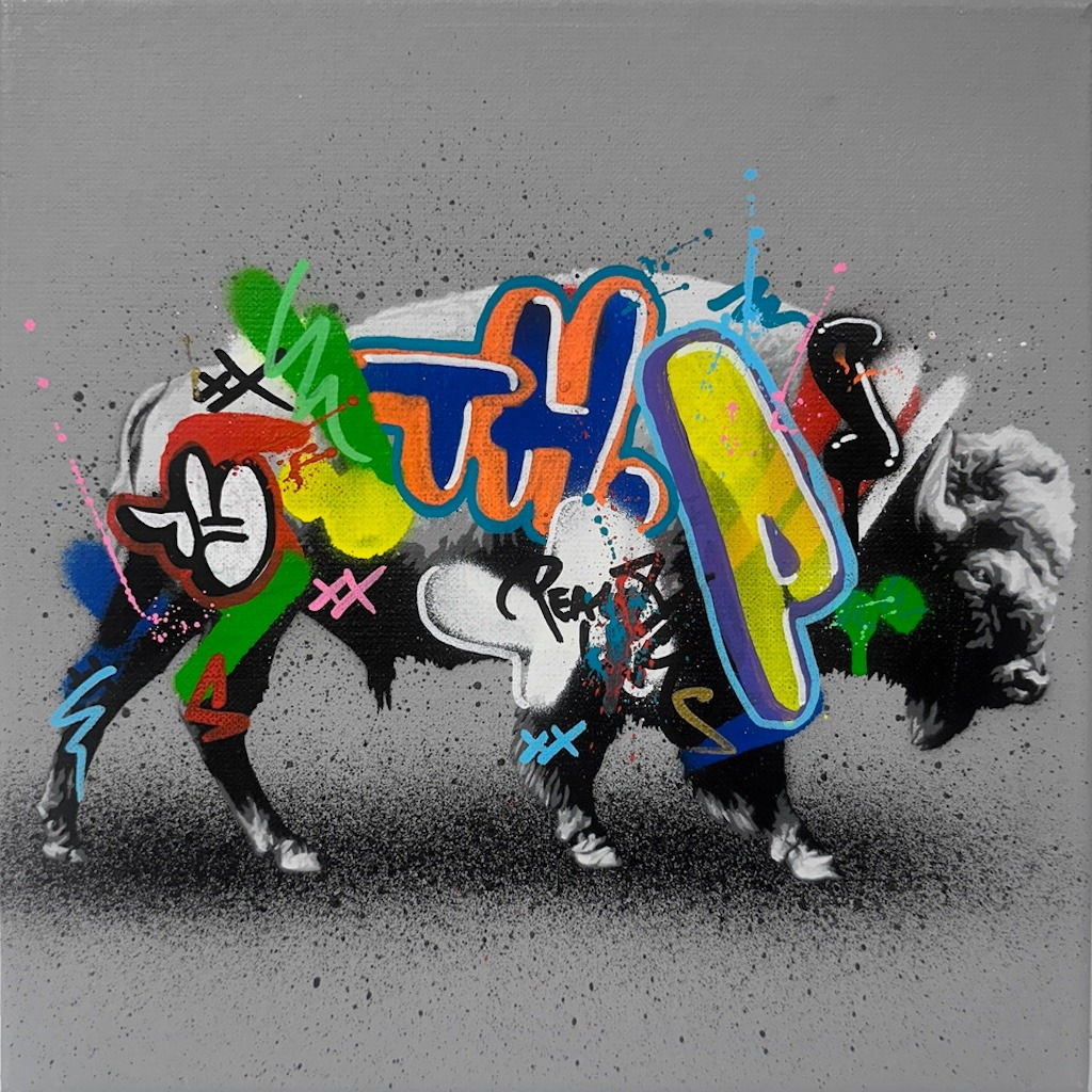 black and white painting of a bison with brightly colored graffiti over its body