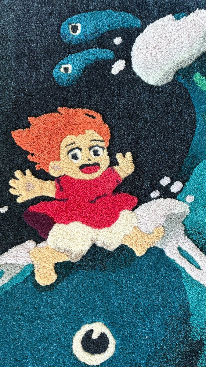 close up of tufted rug with Ponyo characters