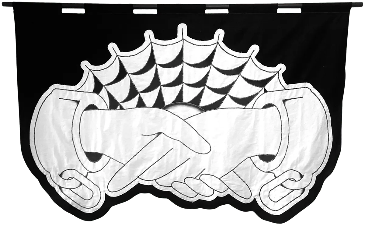 embroidered black and white banner of two hands in cuffs shaking
