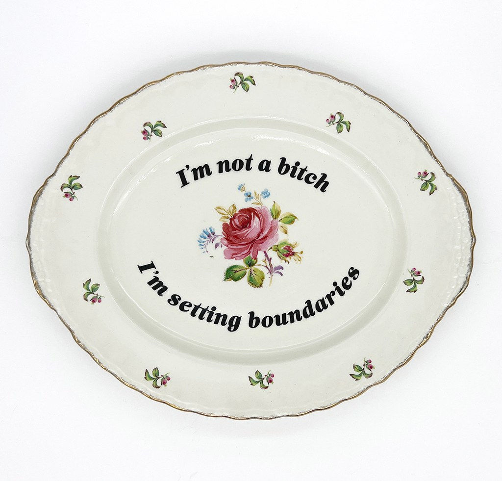 ceramic plates with words painted on them