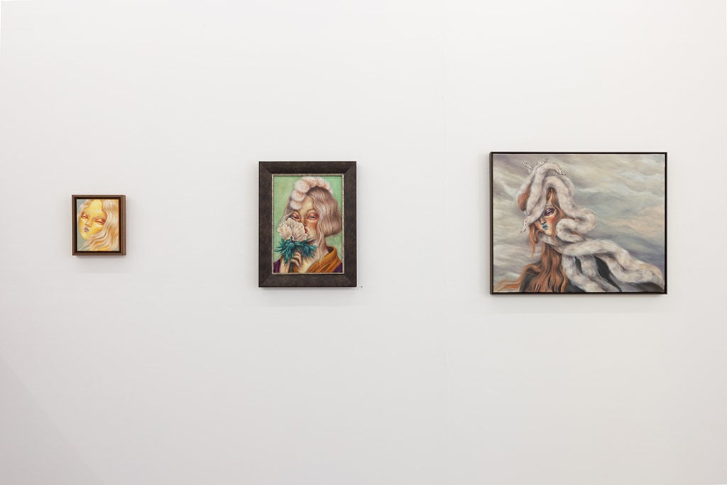 installation shot of three paintings of various size