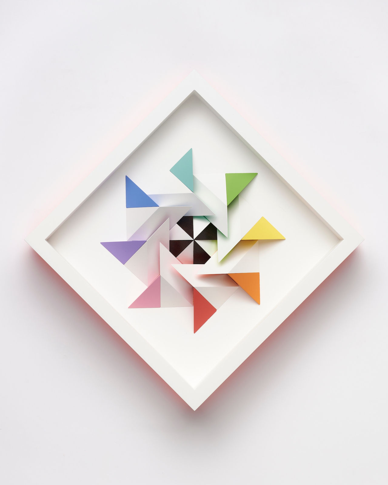 wooden geometric wall sculpture by Sean newport - rainbow