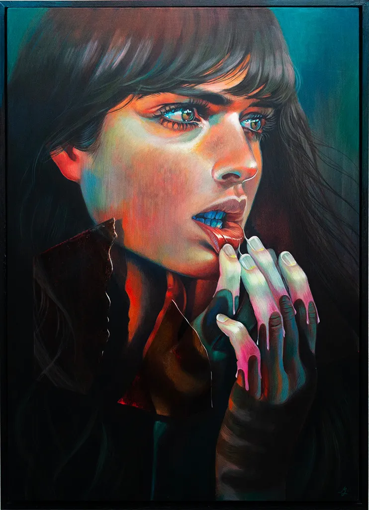 Portrait of a woman holding her hands to her bottom lip turning it out. She has long dark brown hair and eyes.