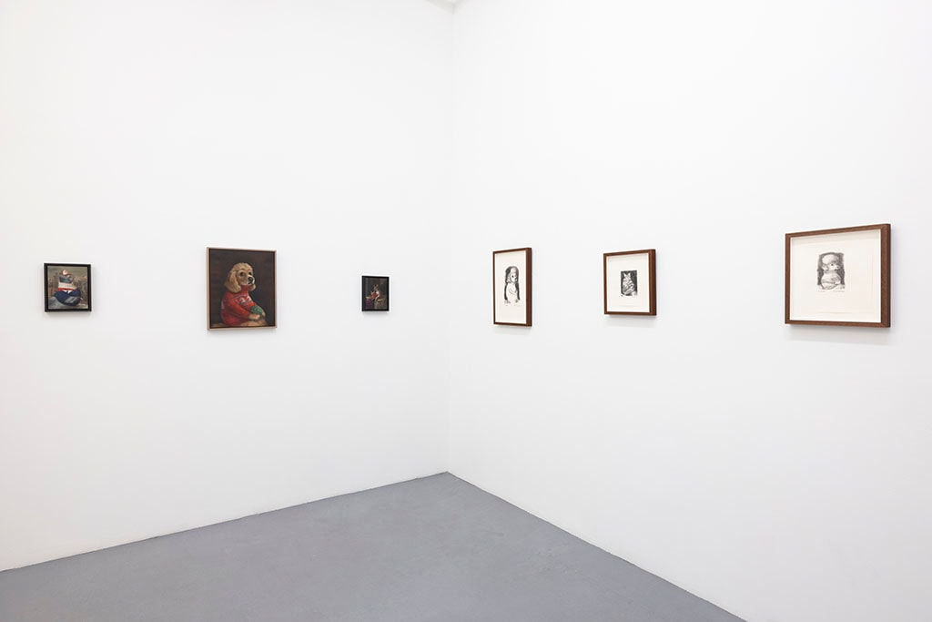 Install photo of Alison Friend's paintings hanging on a white wall