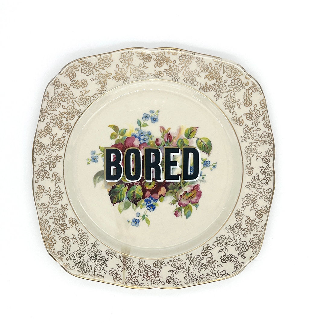 ceramic plates with words painted on them