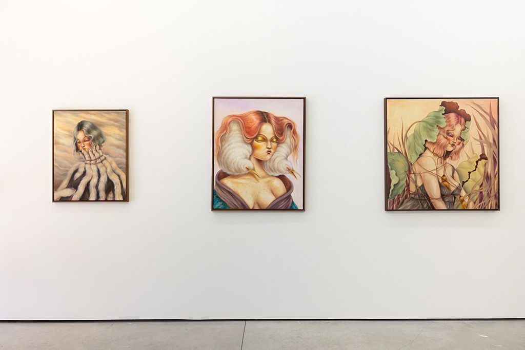 installation shot of three paintings in Miss Van show