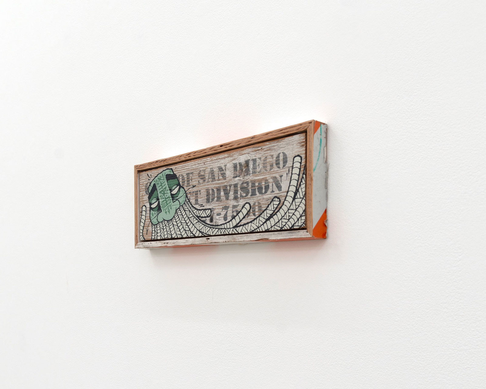 GATS character painted on a white wooden sign with black lettering