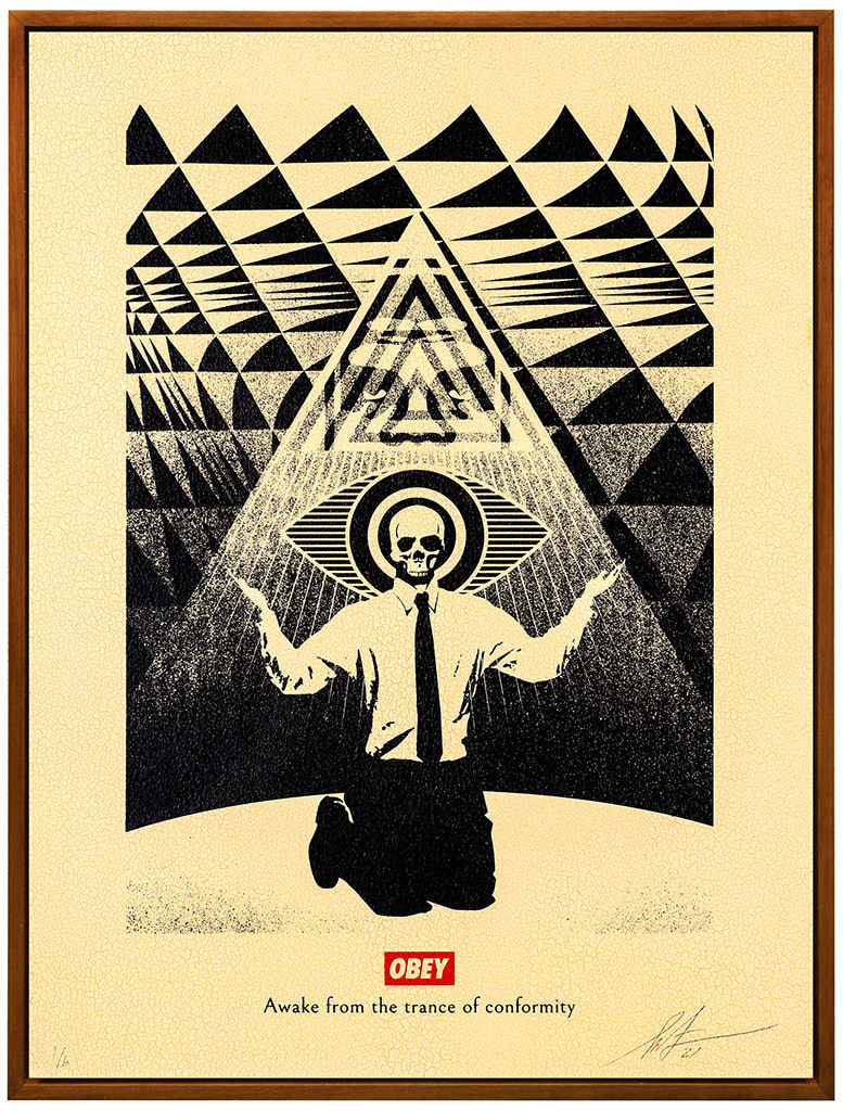 man with a skeleton head kneeling with his arms out with a pyramid behind him and an eye shape around his head. The OBEY logo is on the bottom with text below it