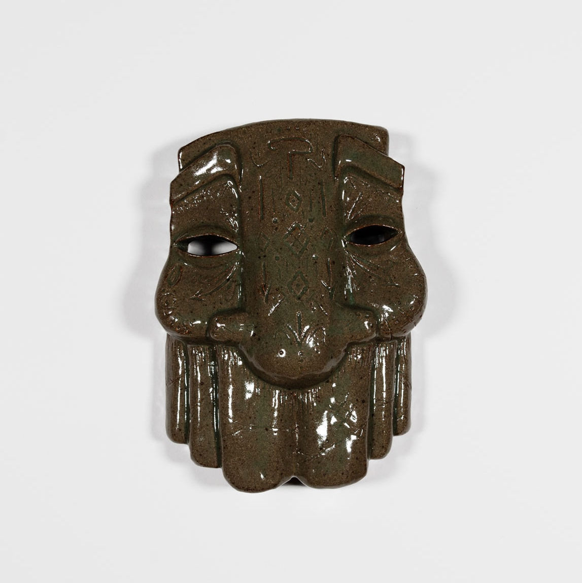 brown sculptural mask