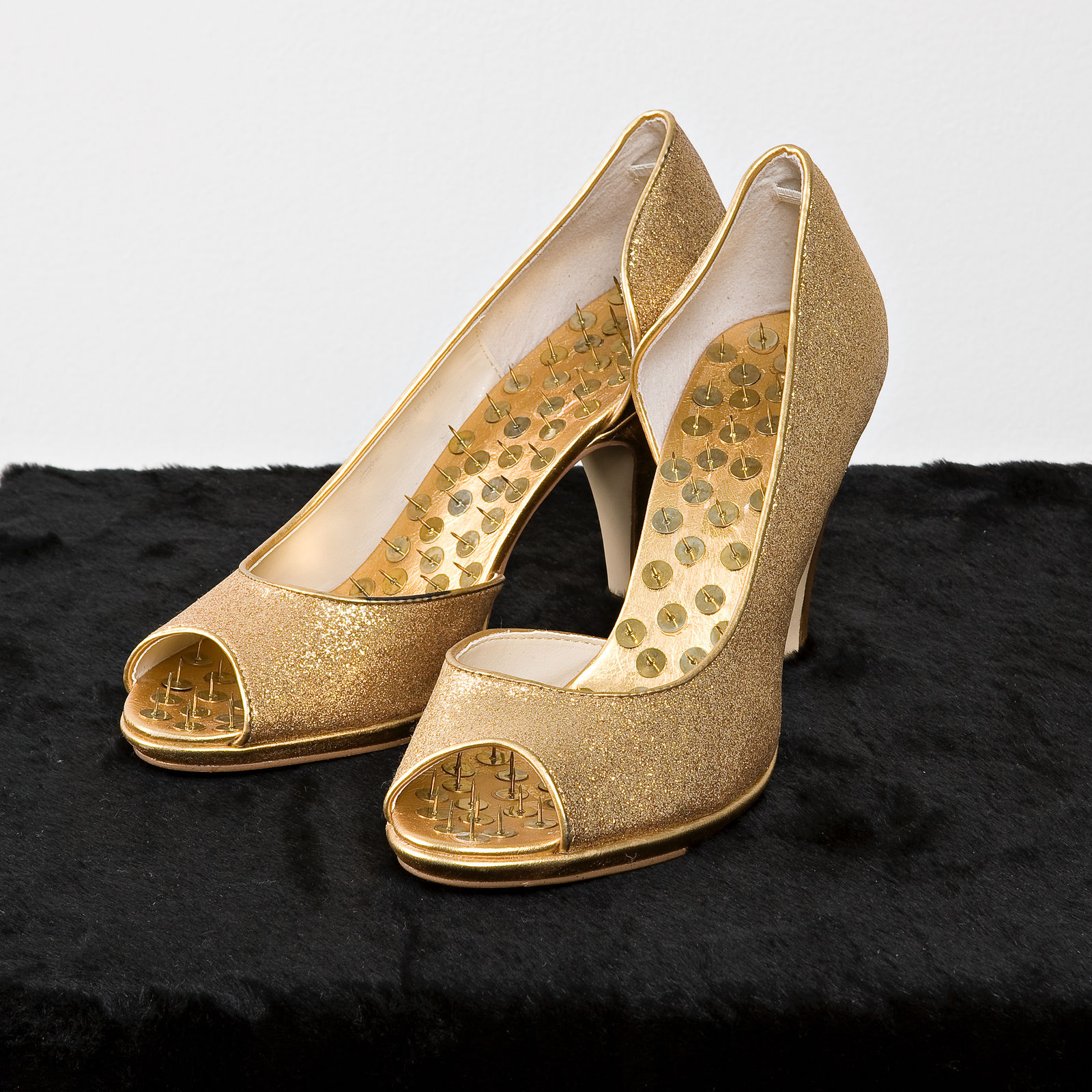 Hans-Peter Feldmann, Golden Shoes with Pins on Velvet, 2005