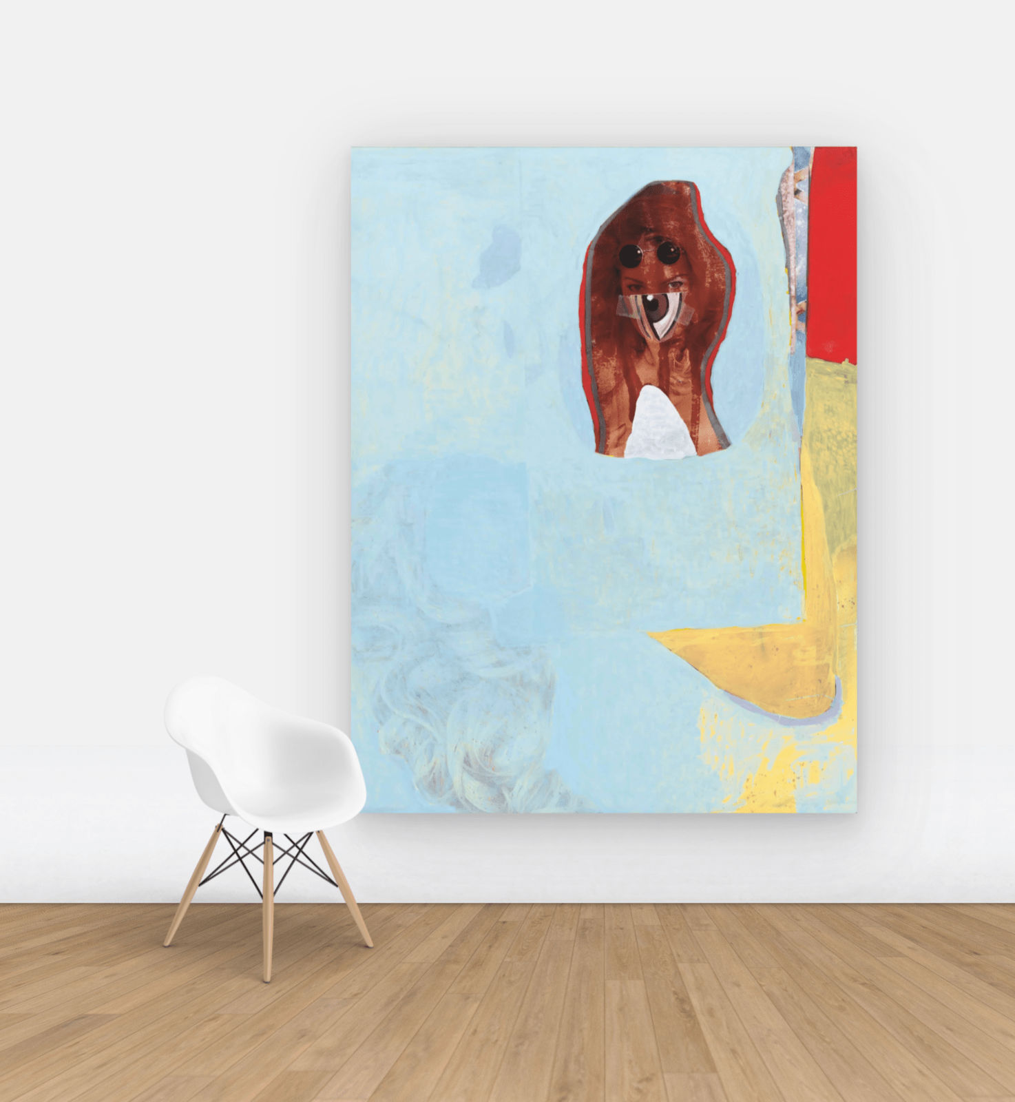 Model covered in an eye and pools of blue and yellow paint on wall