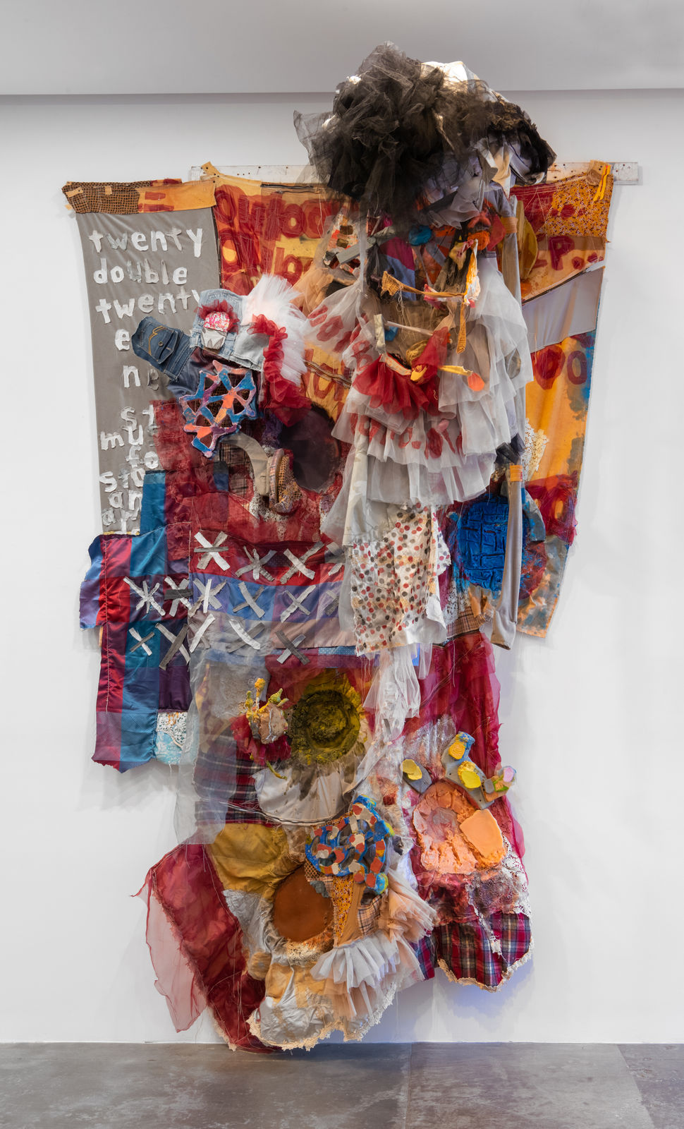 Large wall hanging sculpture made of multicolored scrap fabric