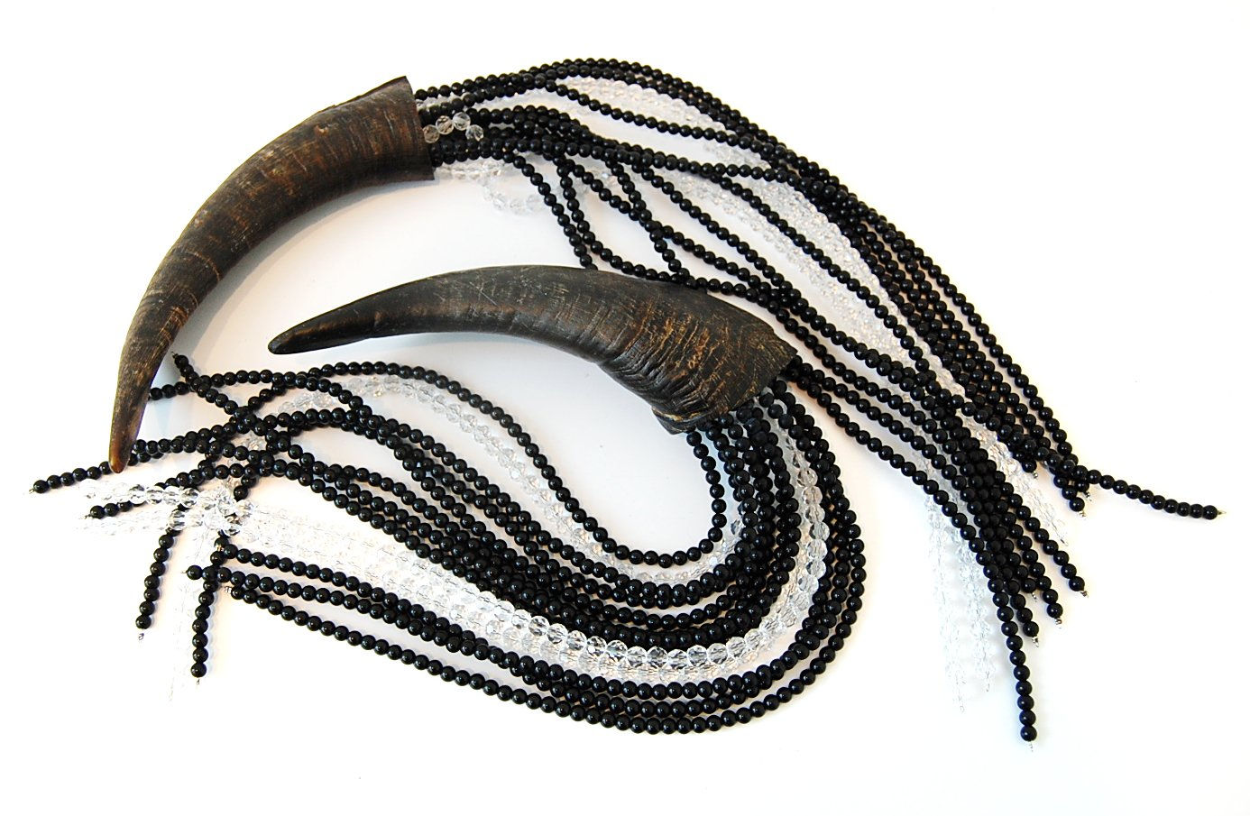 Two antelope horns with beaded tassels