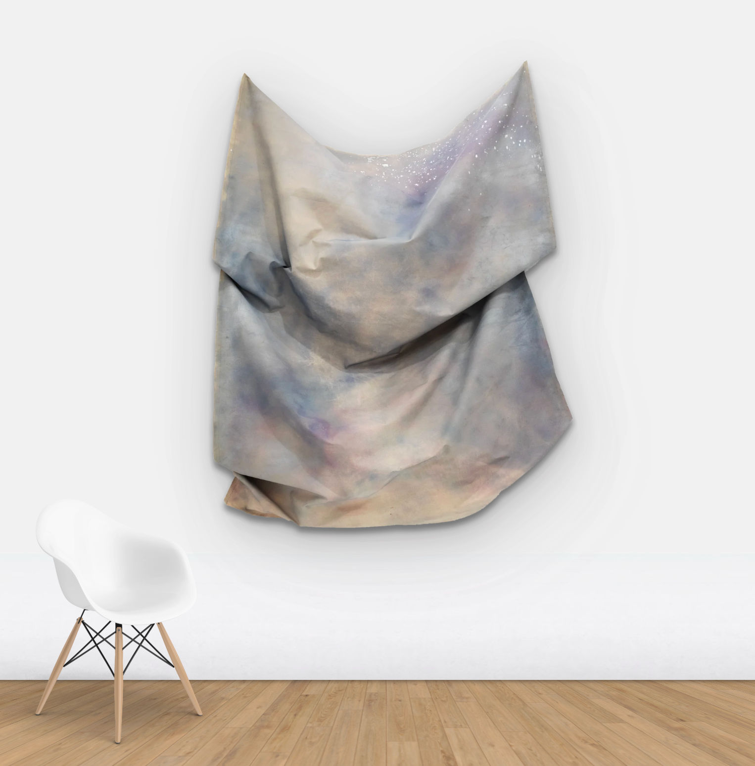wall view of multicolored draped fabric sculpture on wall