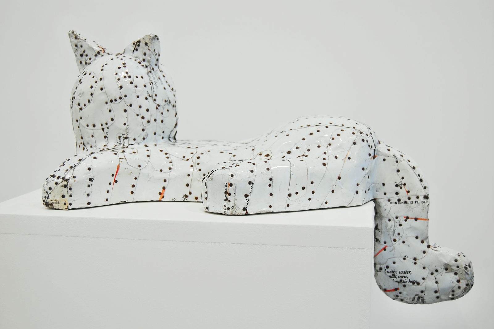 sculpture of a white tin cat