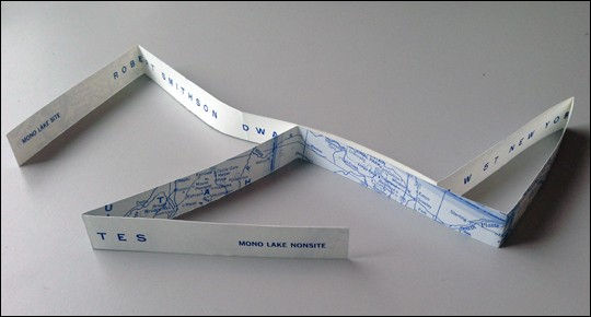 Exhibition announcement published in conjunction with show held February 1 - February 27, 1969. Object takes the form of a long folded strip with a map on recto beginning at Mono Lake, California, and terminating at New York City, with exhibition data printed on the verso