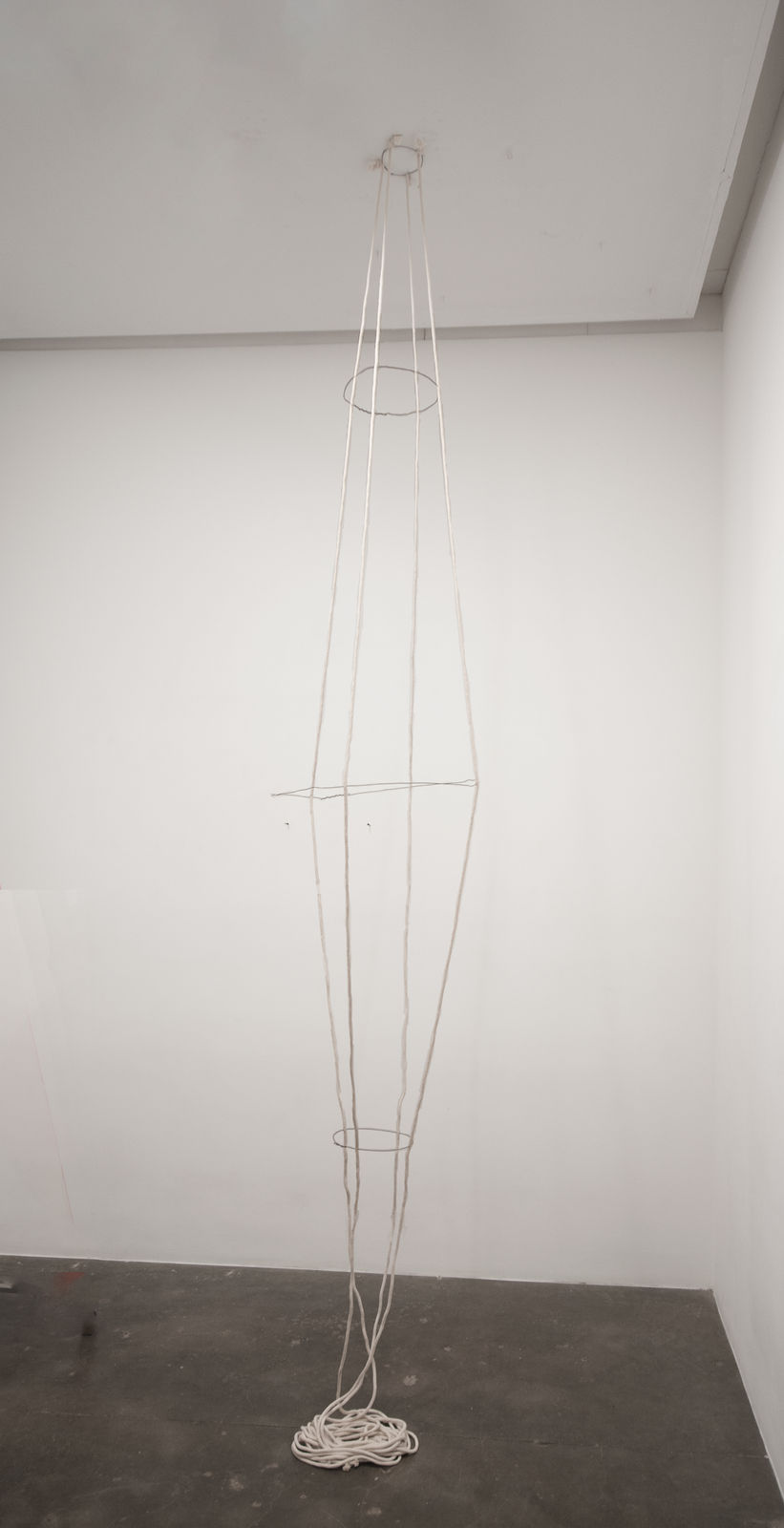 Rope and metal wire vessel hanging from the ceiling