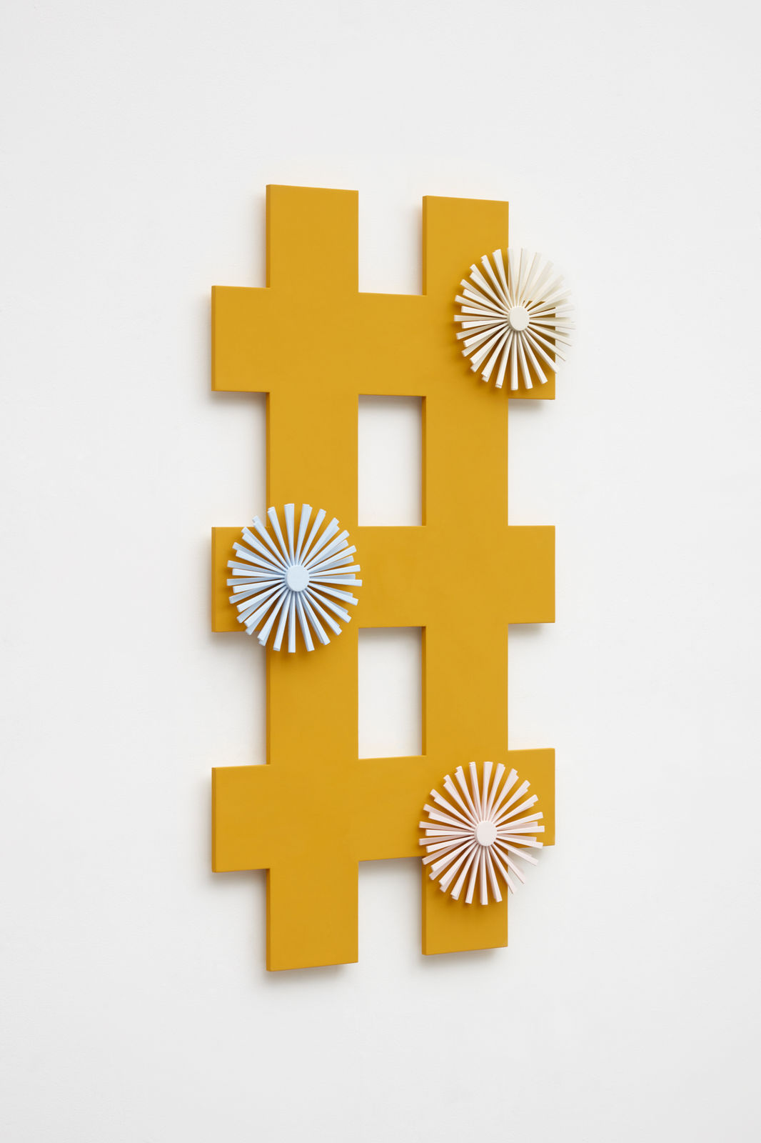 orange criss cross wall sculpture