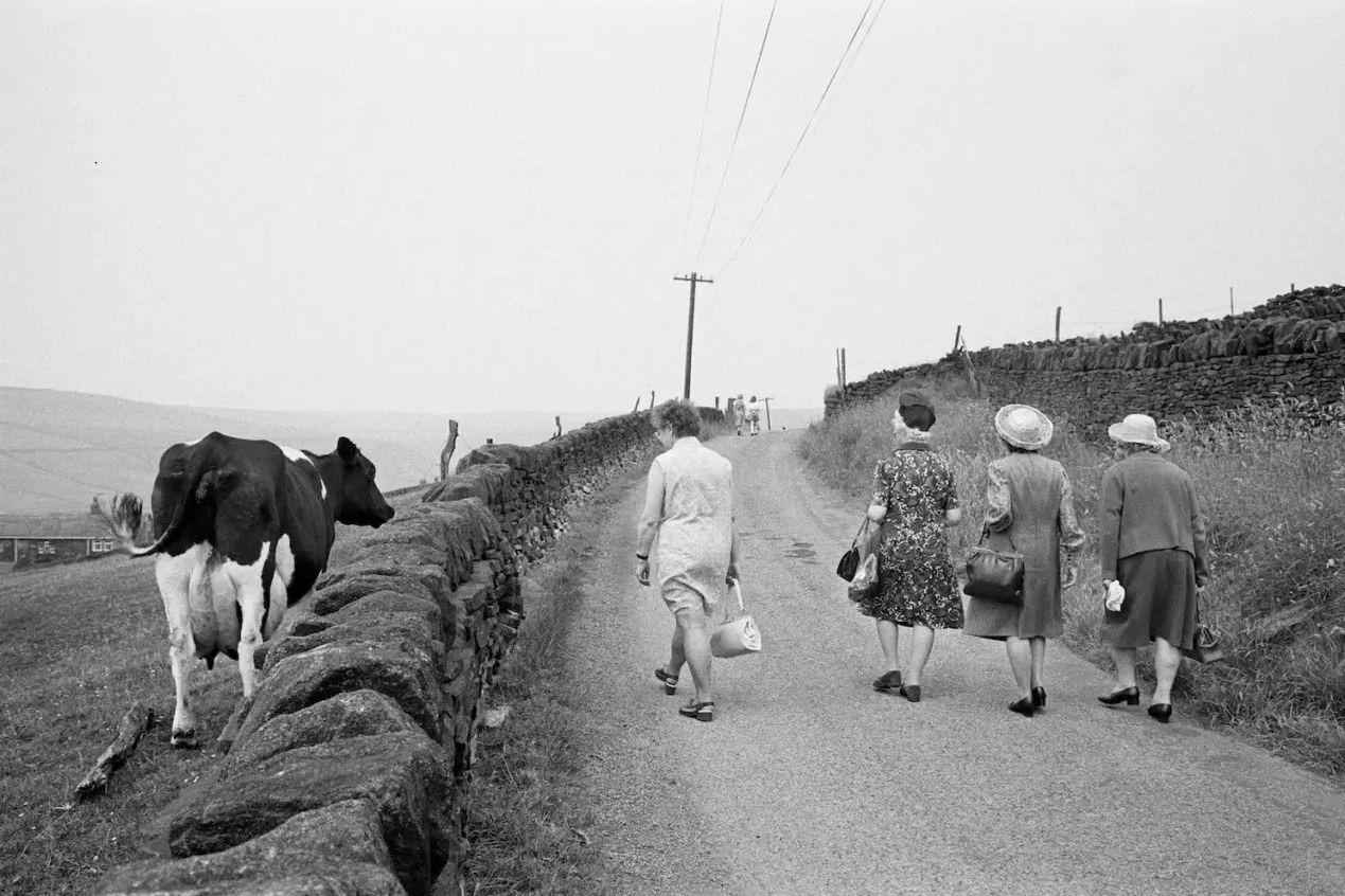 Martin Parr, Crimsworth Dean. Some of the congregation making their way to the Crimsworth Dean Chapel Anniversary, West Yorkshire, England, 1975