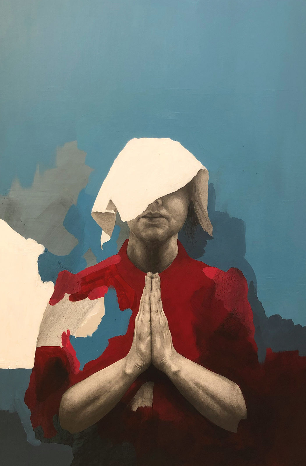 Painted woman with cloth over her head praying