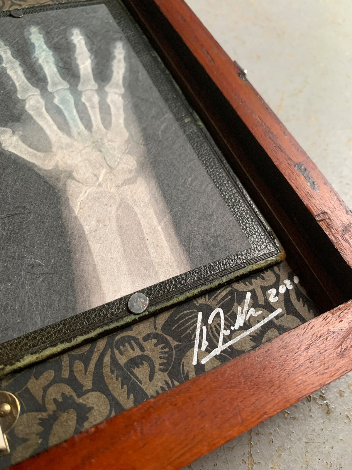 Vintage wooden story box, photographed x-ray hand