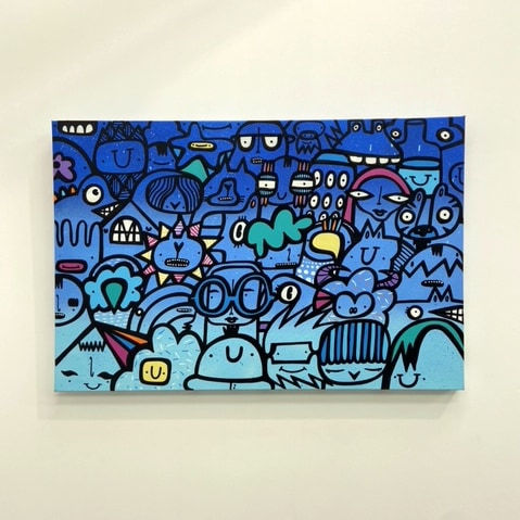 Blue street style cartoon art painting hung on wall