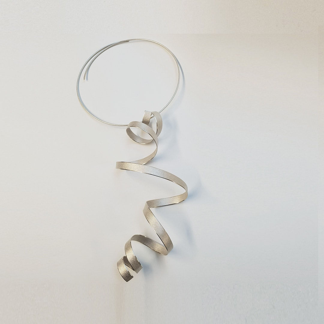 sculptural pendant – calligraphy - in recycled silver - sculptural jewellery by artist Ute Decker