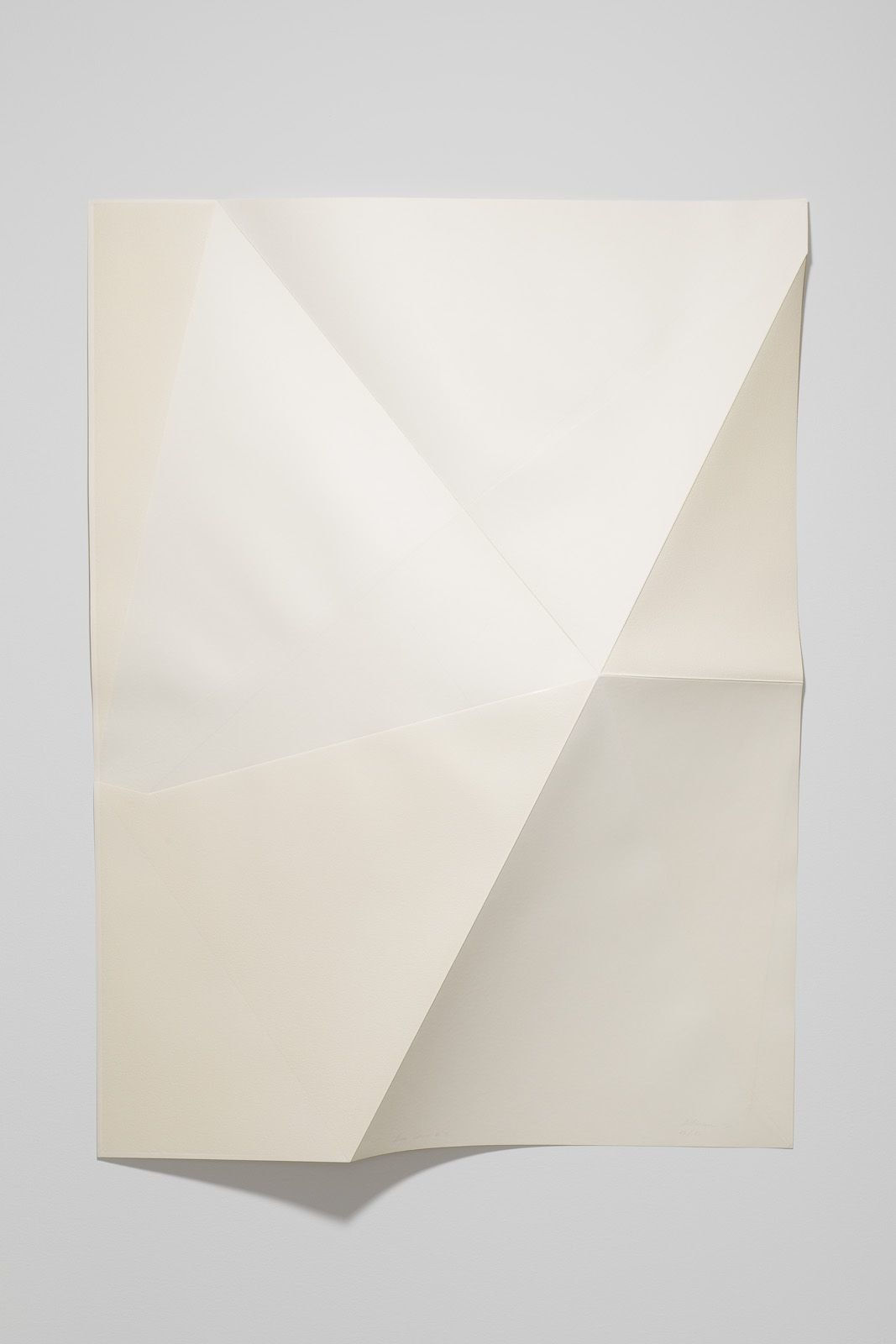 Series of white folded paper pieces