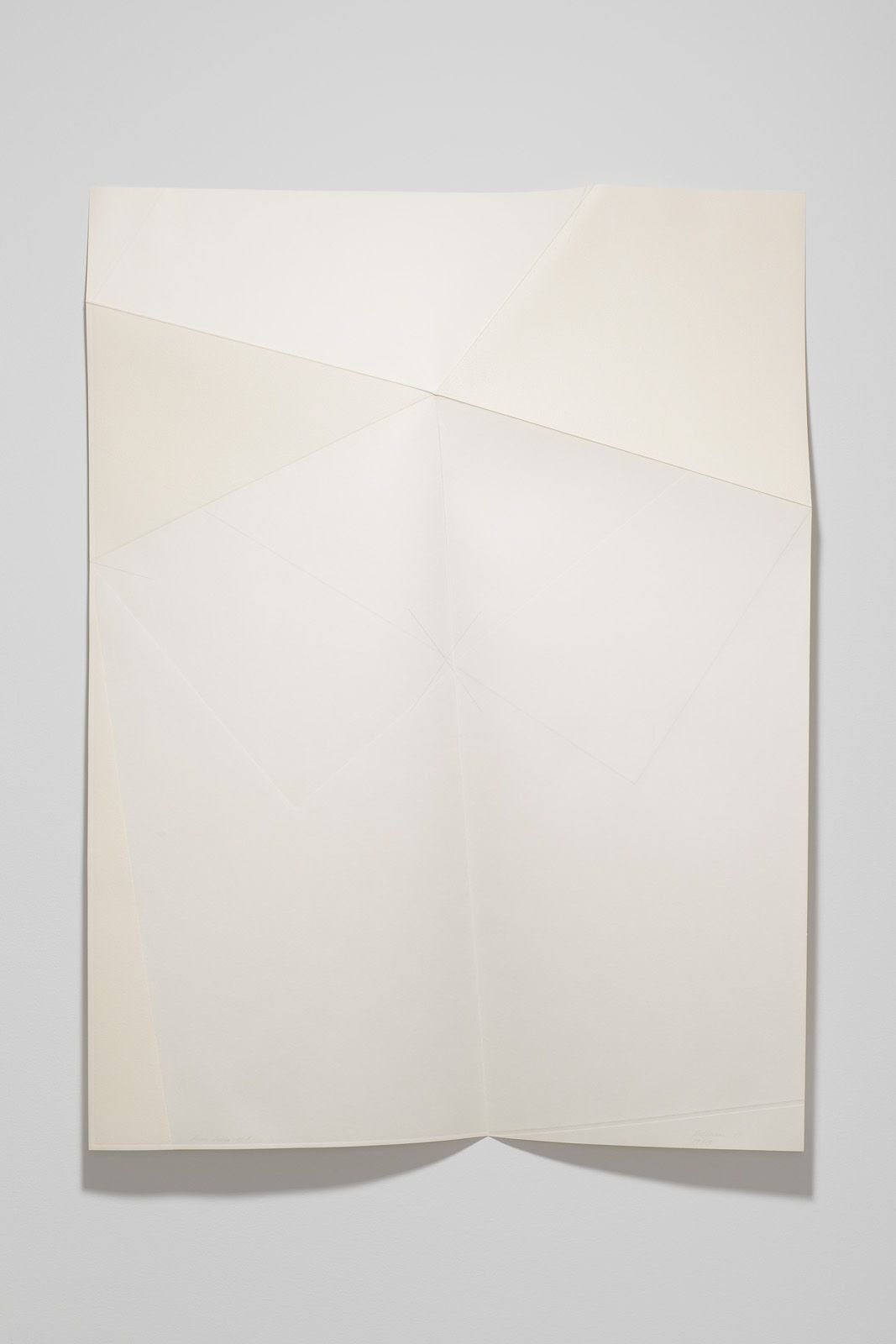 Series of white folded paper pieces