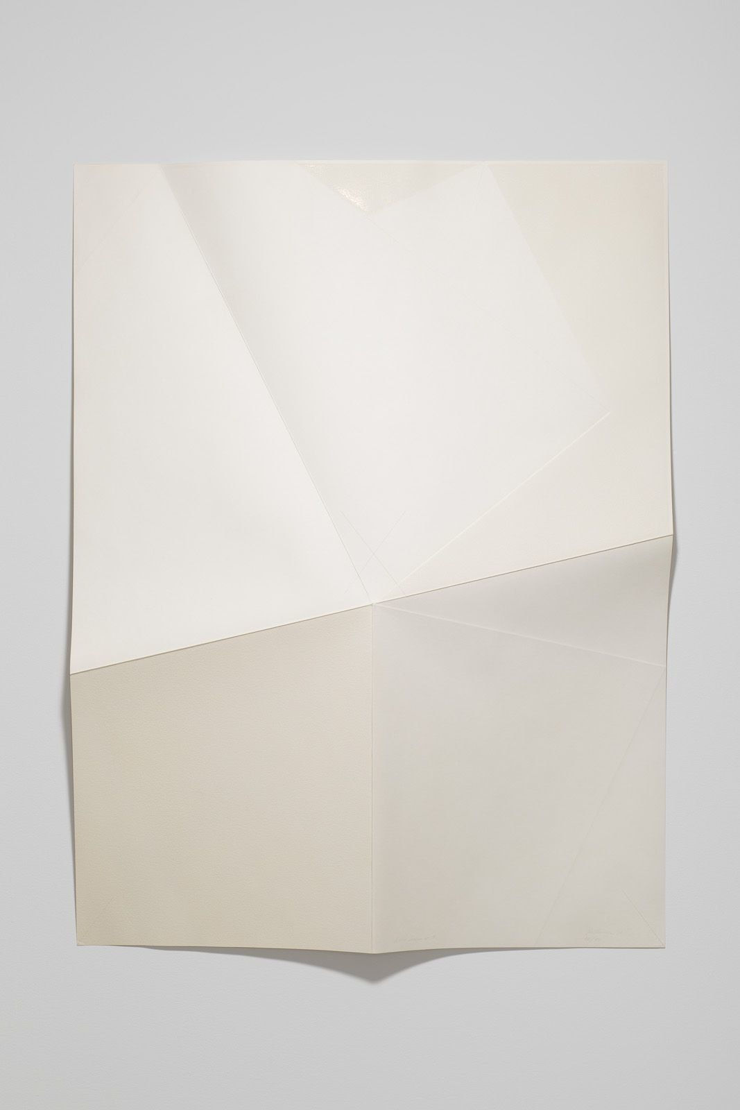 Series of white folded paper pieces