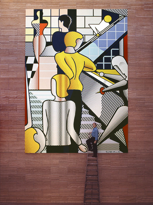 Photograph of Roy Lichtenstein on a ladder in front of a multicolored (yellow, red, white, black, blue) mural of figures ascending a staircase