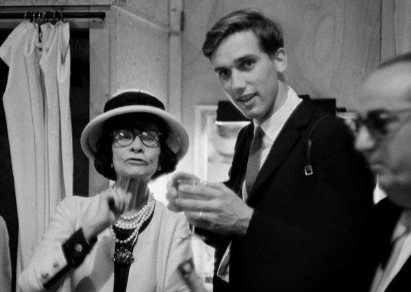 Black and white photograph of Designer Coco Chanel and a young Douglas Kirkland in the House of Chanel