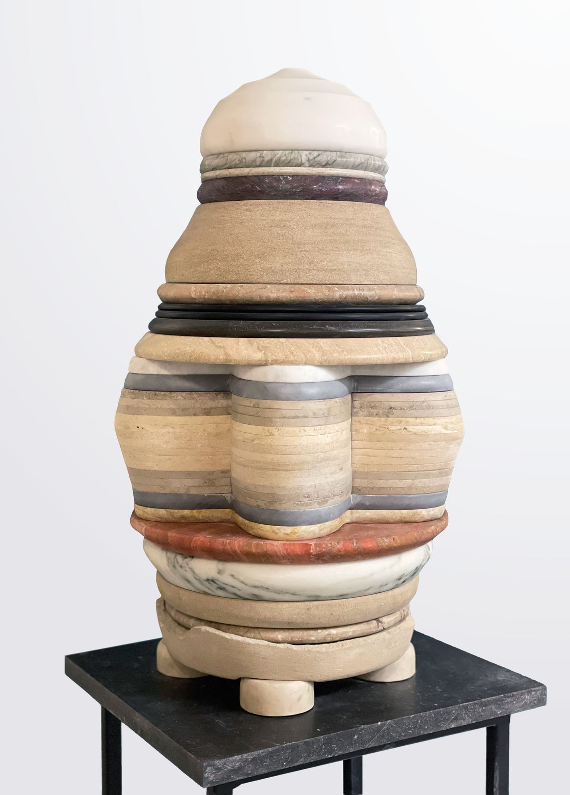 Medium-sized sculpture comprising layers of foliated marble and stone of varying color and thickness