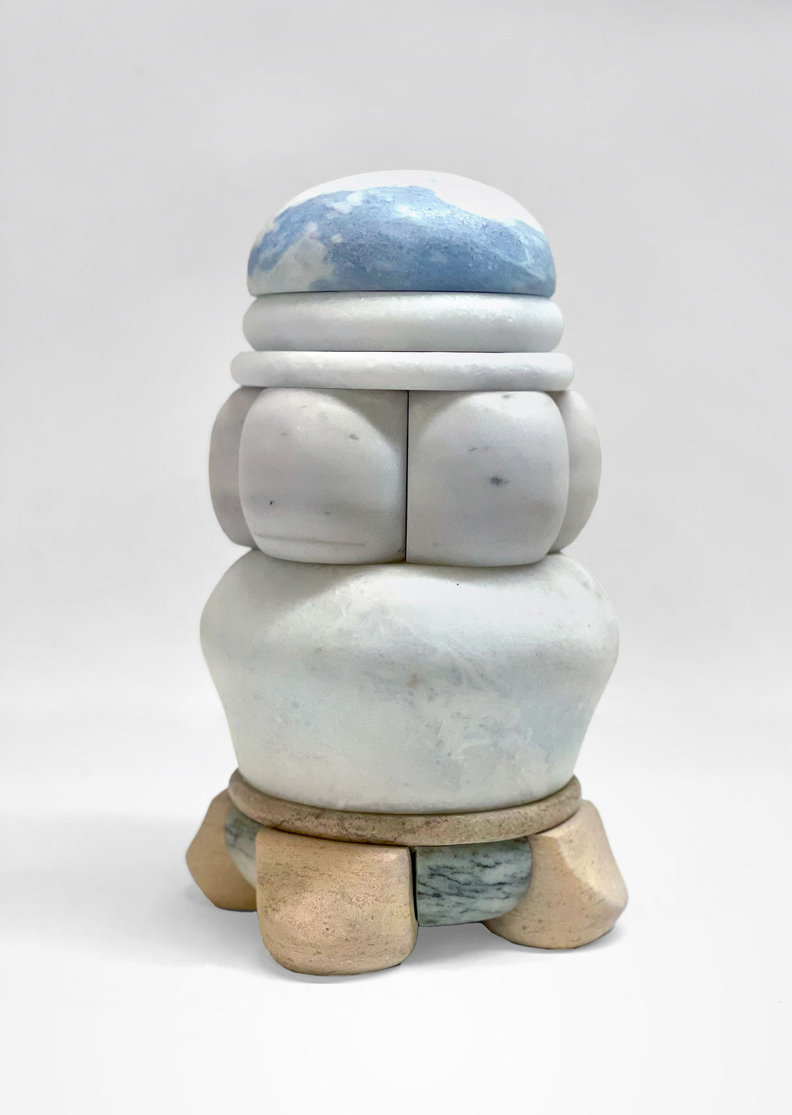 Medium-sized sculpture comprising layers of foliated marble and stone of varying color and thickness