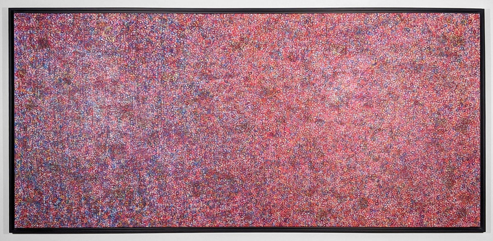 Acrylic and mixed media on canvas in an abstract expressionist mode of thousands of multicolored, primarily purple, small rings creating a sense of cosmic depth