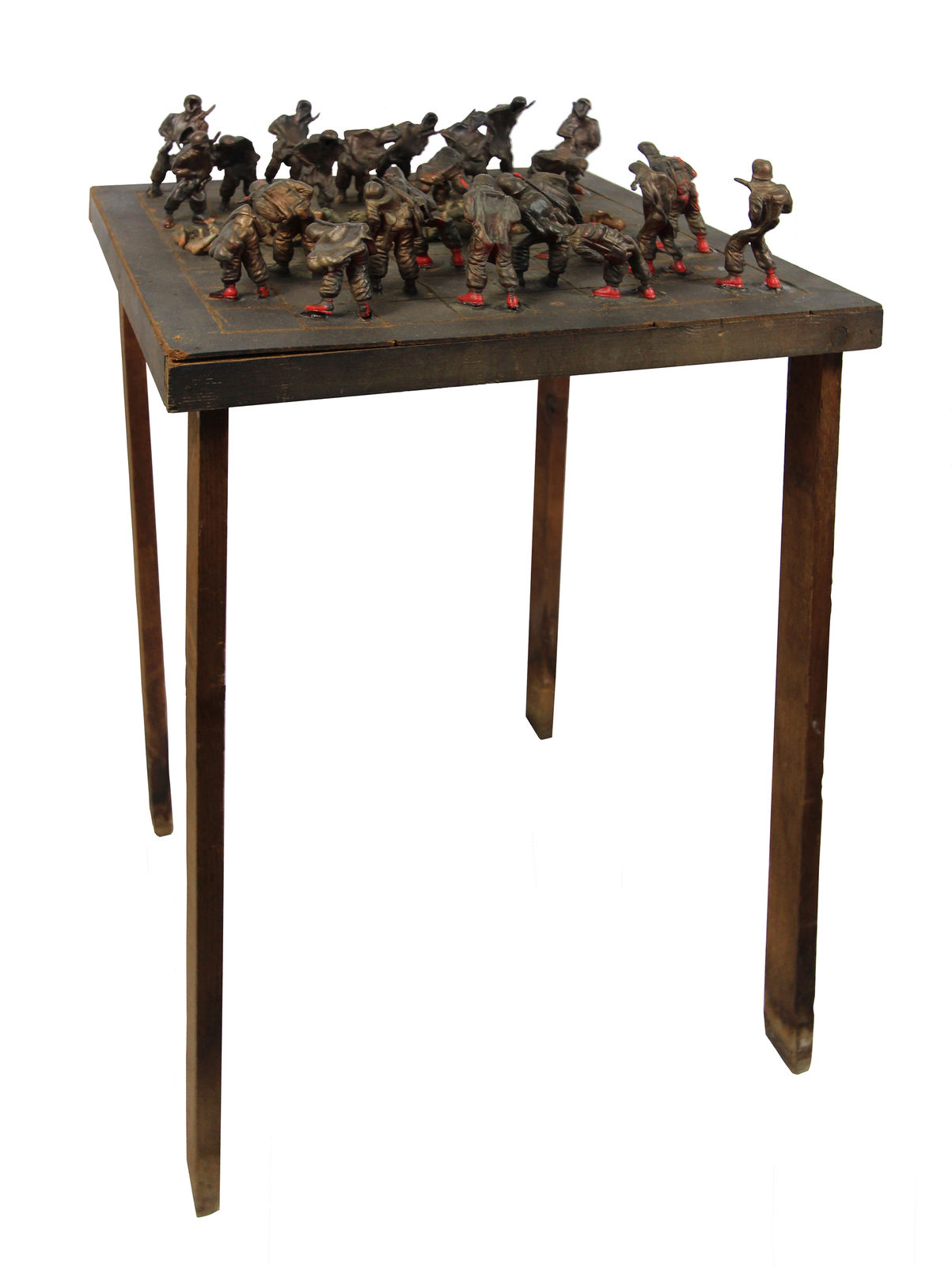 Assemblage sculpture by Sam Goodman of a chess table with solider figurines rather than chess pieces