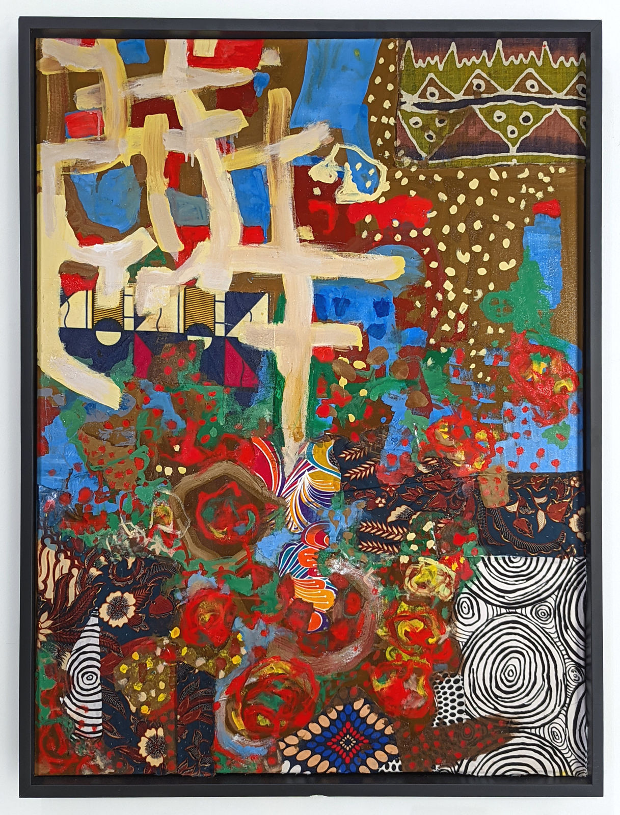 Framed colorful artwork comprised of oil paint and patterned fabric canvas in a 