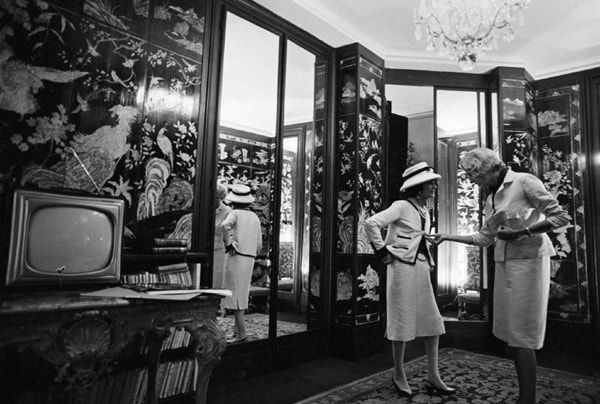 Black and white photograph of Designer Coco Chanel and Madame Claude Pompidou in the House of Chanel