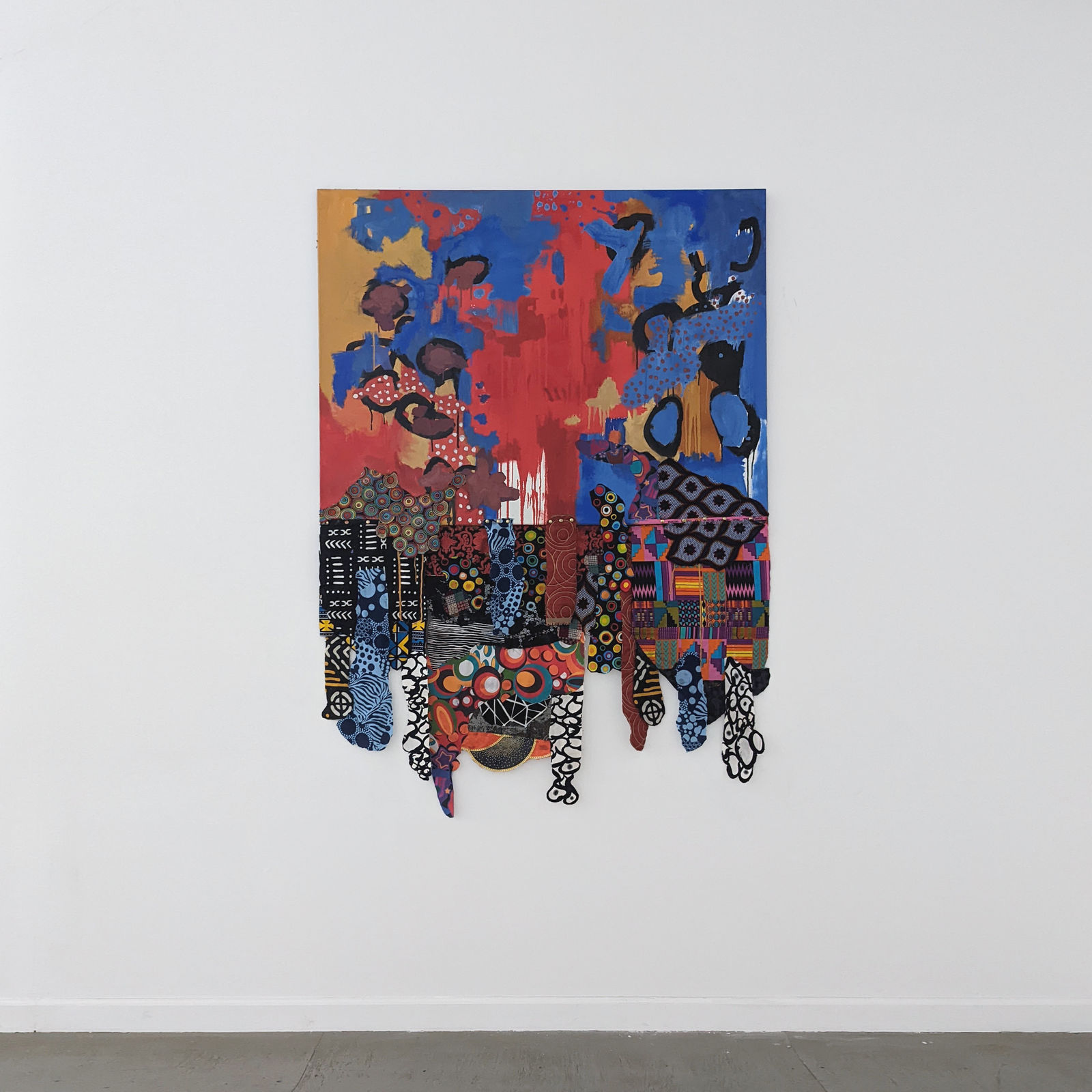 Colorful artwork comprised of oil paint and patterned fabric extending past the botto of the canvas in a 