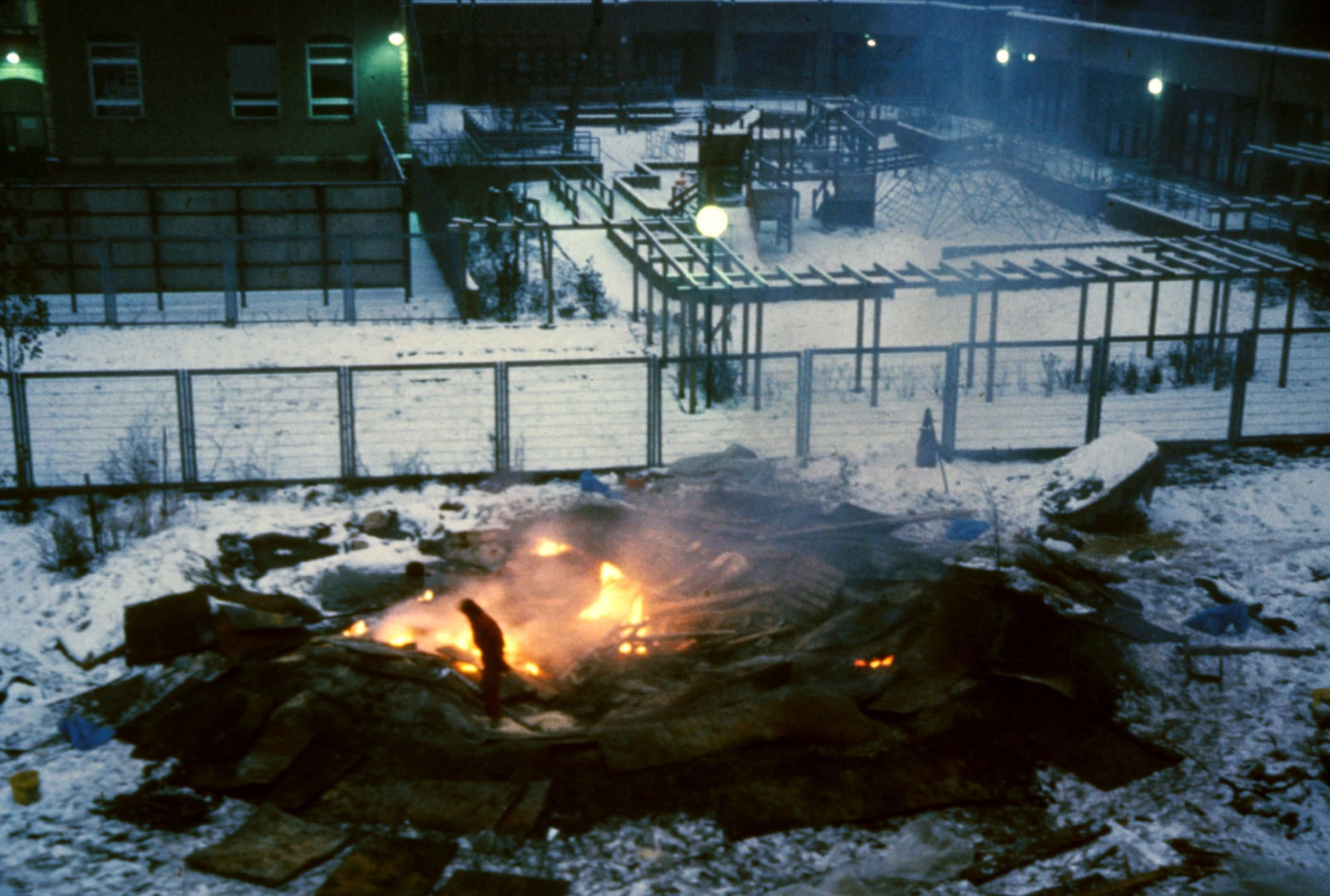 Photo of a small bonfire outside in the winter