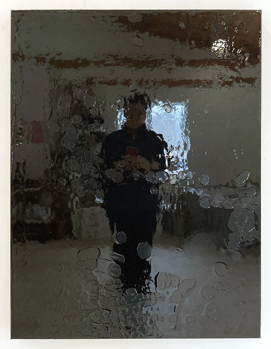 A rectangular wood panel covered in reflective black urethane resin, black vinyl, and mixed media is mounted on a white wall