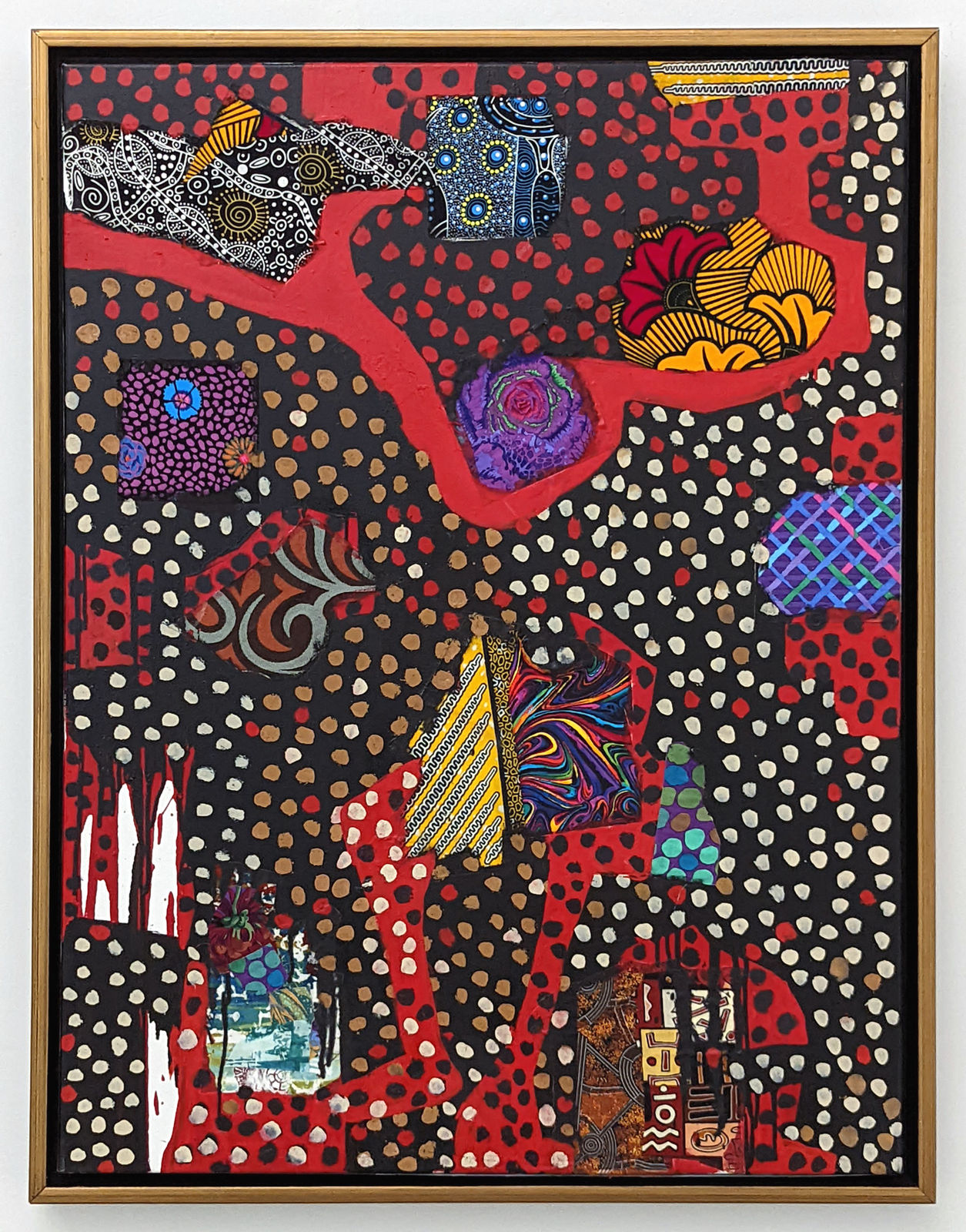 Framed colorful artwork comprised of oil paint and patterned fabric canvas in a 