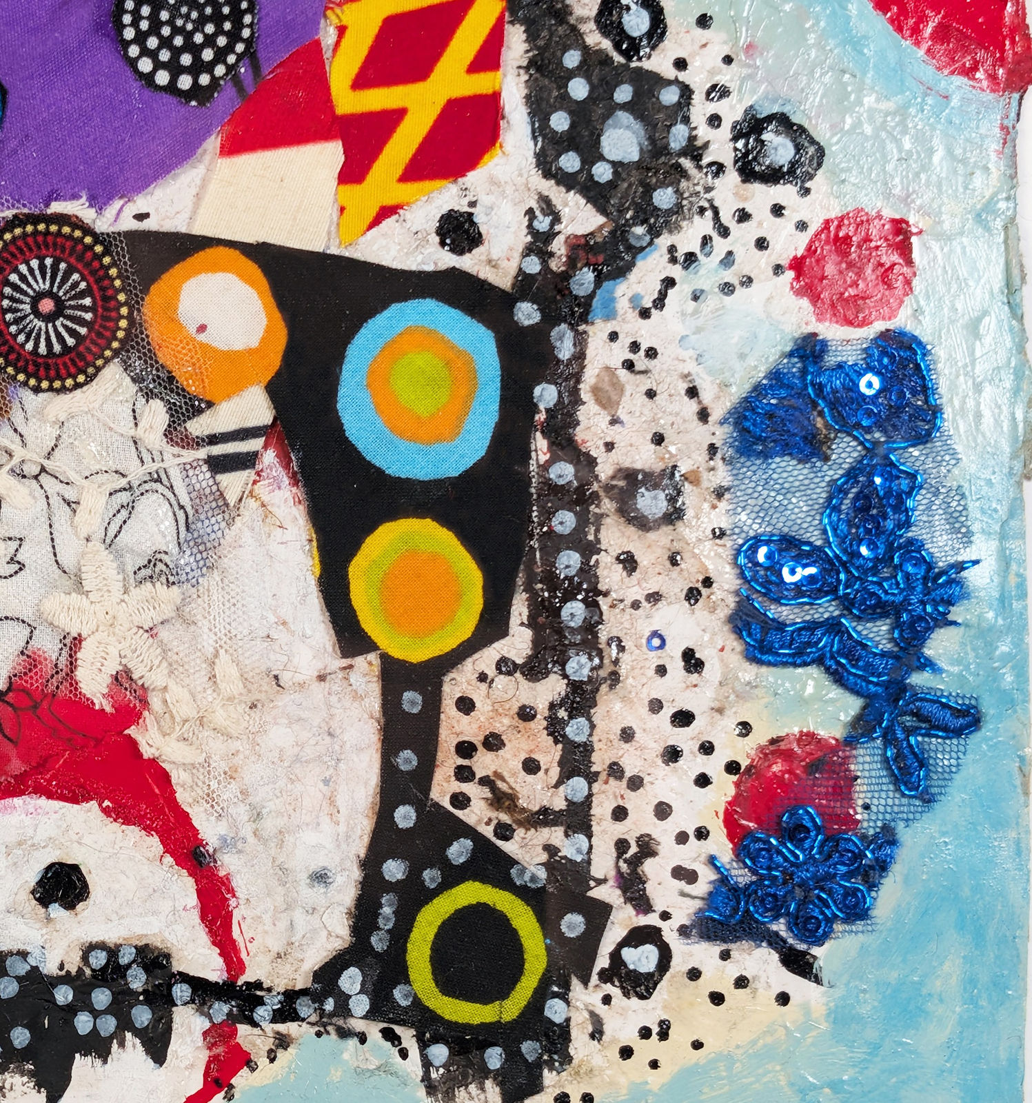 Detail of a colorful artwork comprised of oil and patterned fabric on canvas in a 