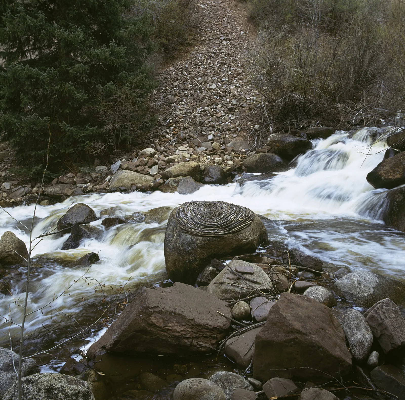 Andy Goldsworthy, Reworked sticks on river boulder, Hunter Creek, Colorado, May 2006, 2006