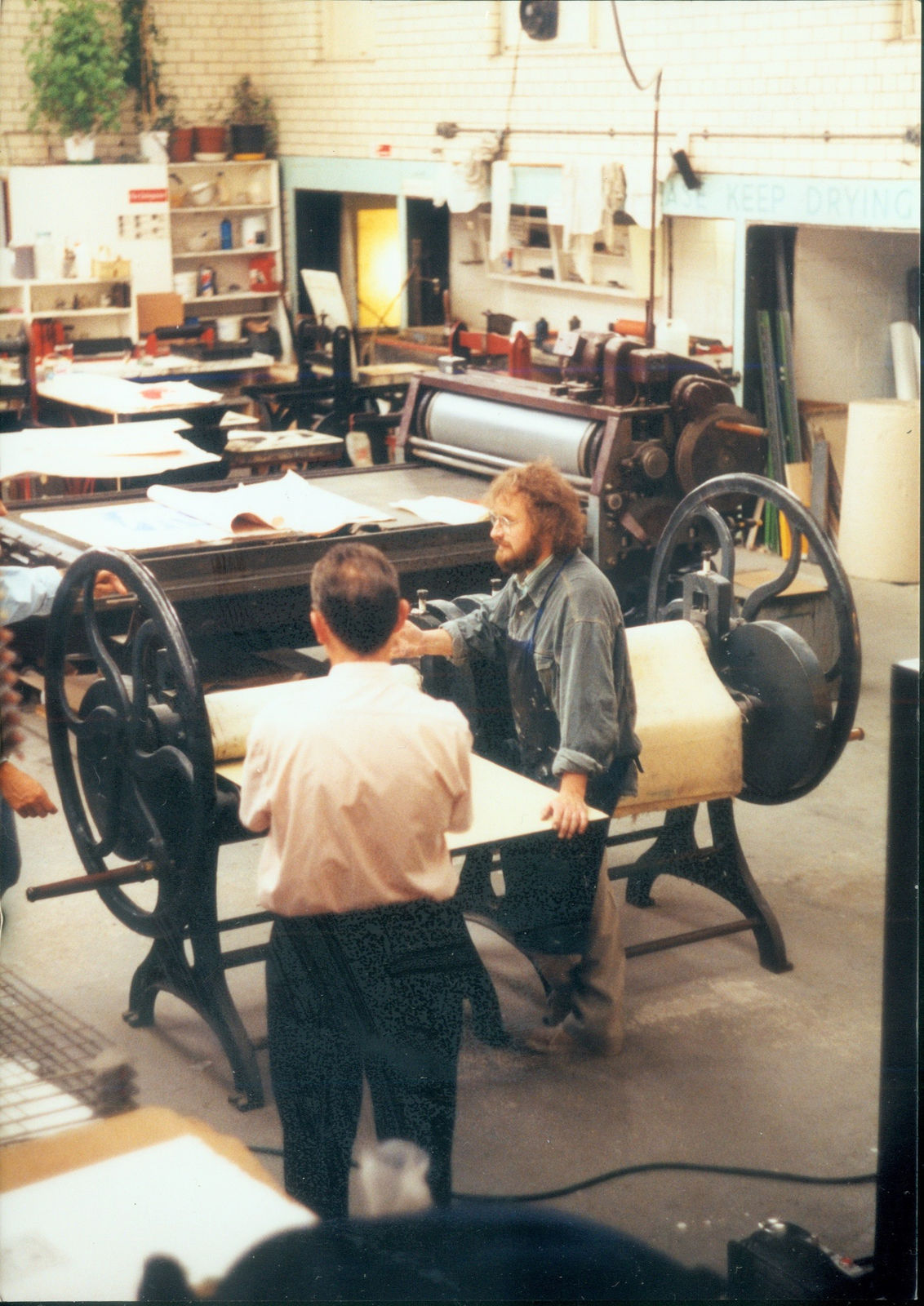 John Bellany and Alfons Bytautas at the etching press, Edinburgh Printmakers, Union Street.