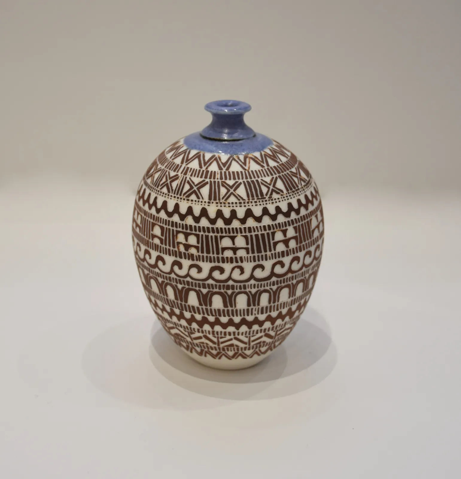 Cherry Tewfik, Patterned brown bottle
