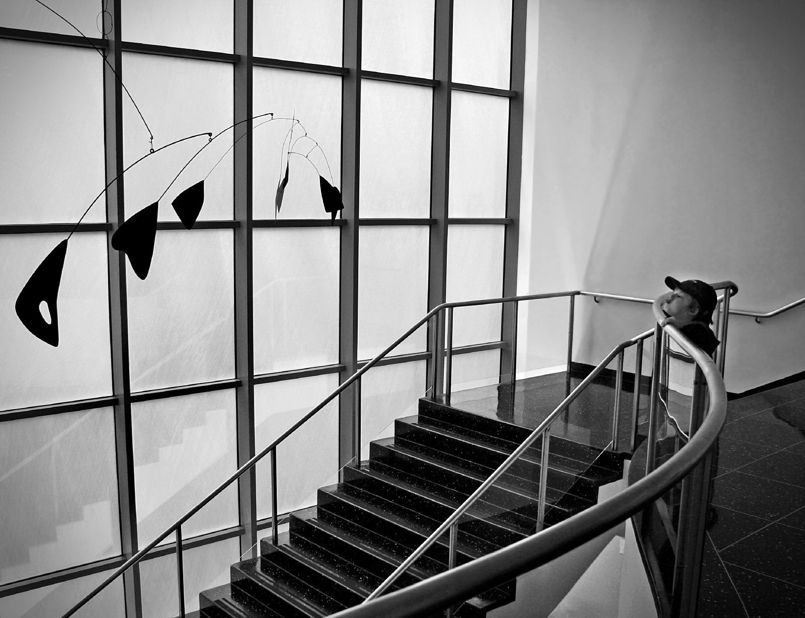 Boy with Alexander Calder Sculpture Photo by Dimitry B is licensed under CC BY 2.0. Taken on May 20, 2011.