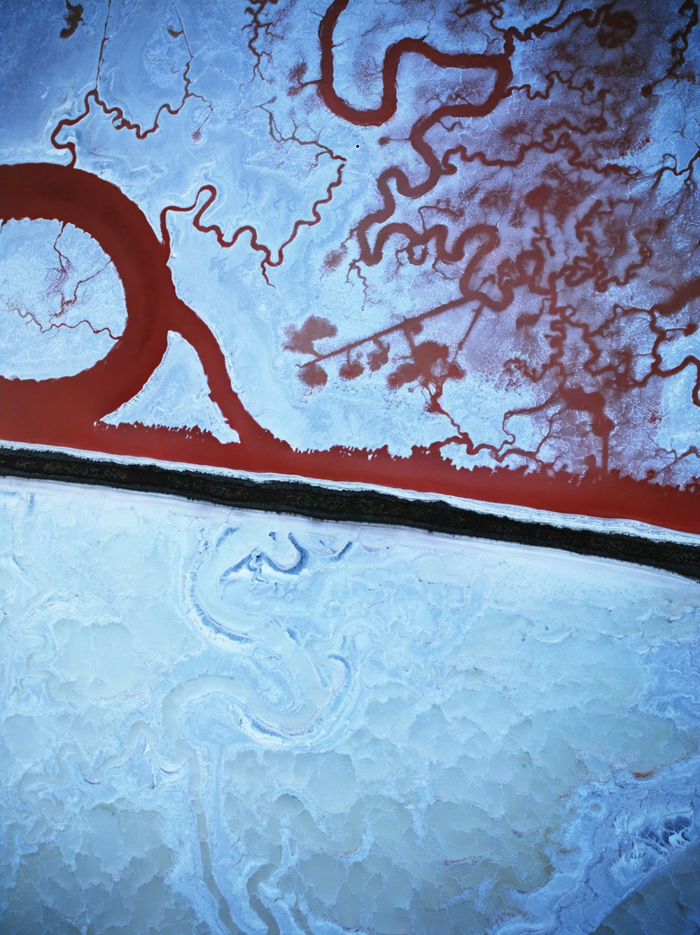 An aerial photograph of a salt pond