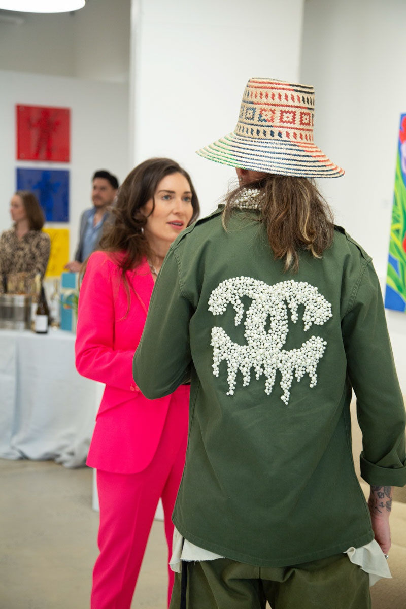 People at Carousel Fine Art's gallery space in Buckhead Village, Atlanta during the Caroline Dechamby Retrospective.