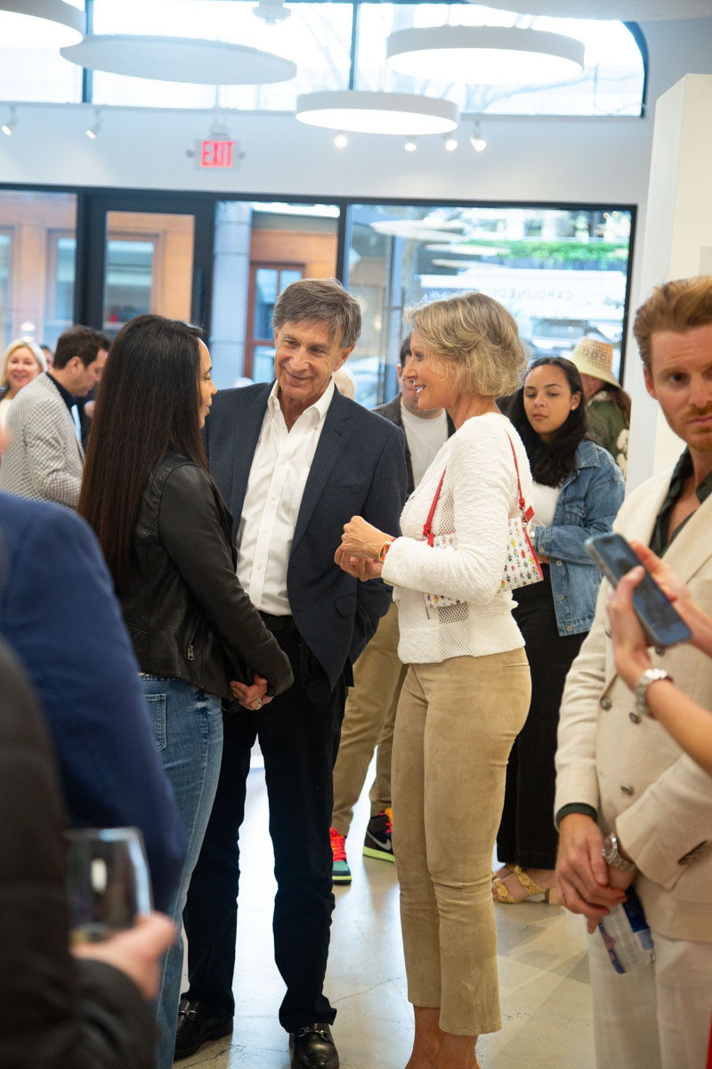 People at Carousel Fine Art's gallery space in Buckhead Village, Atlanta during the Caroline Dechamby Retrospective.